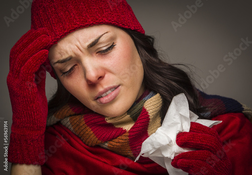 Photo: Miserable Mixed Race Woman Blowing Her Sore Nose with Tissue Miserable Mixed Race Woman Blowing Her Sore Nose with Tissue