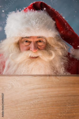 Photo: Santa Claus Opening Christmas magic concept Santa Claus Opening Christmas magic concept