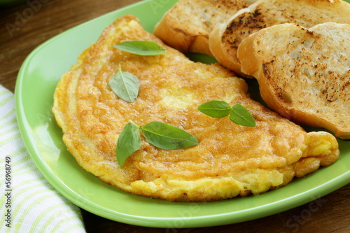 Photo: fresh egg omelet with basil for breakfast fresh egg omelet with basil for breakfast