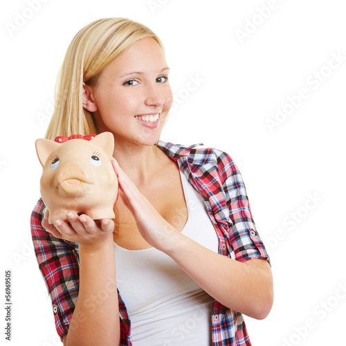 Photo: Lachendes Mädchen mit Sparschwein Lachendes Mädchen mit Sparschwein