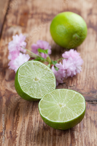 Photo: Limes on wood background Limes on wood background