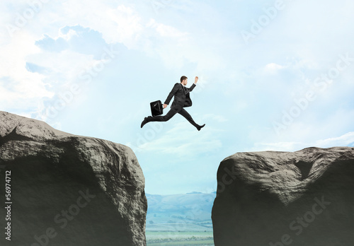 Photo: young businessman jumping young businessman jumping