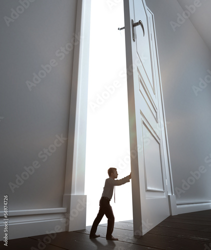 Photo: businessman opens door businessman opens door