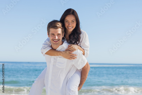 Photo: Happy couple smiling at camera Happy couple smiling at camera