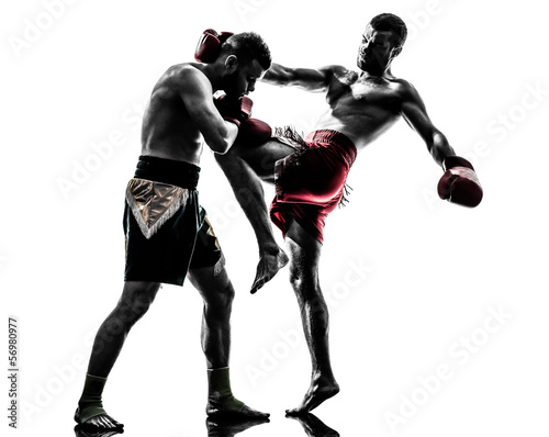 Photo: two men exercising thai boxing silhouette two men exercising thai boxing silhouette