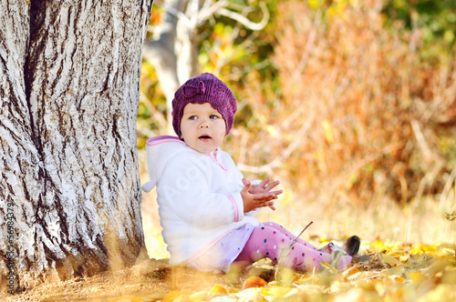 Photo: baby girl under the tree baby girl under the tree