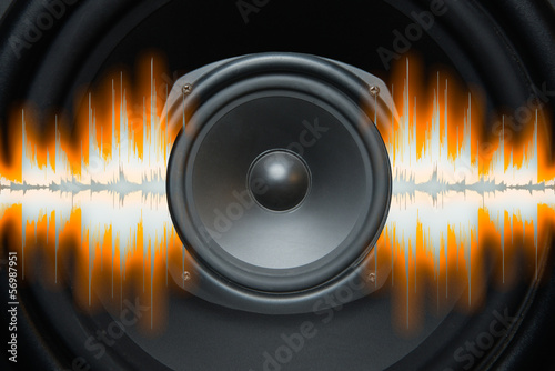 Photo: Audio speaker with sound wave patterns of music Audio speaker with sound wave patterns of music