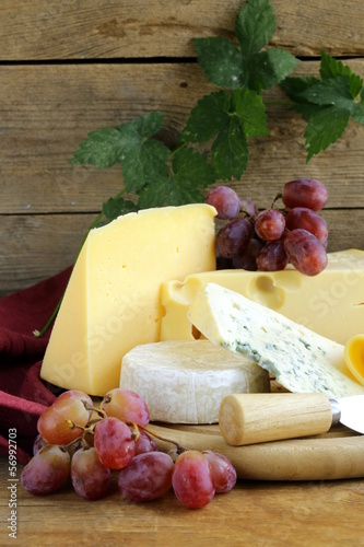 Photo: cheeseboard (Maasdam, Roquefort, Camembert) and grapes cheeseboard (Maasdam, Roquefort, Camembert) and grapes