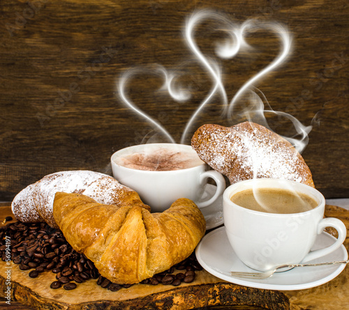 Photo: Croissants and coffee with heart- shaped steam Croissants and coffee with heart- shaped steam