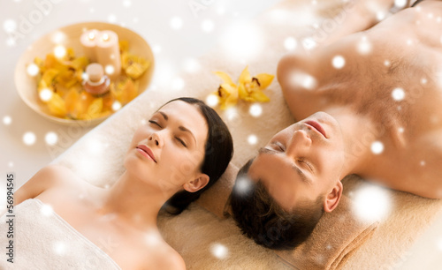 Photo: couple in spa salon lying on the massage desks couple in spa salon lying on the massage desks