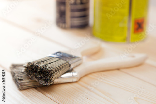 Photo: Paint brushes on wooden planks Paint brushes on wooden planks