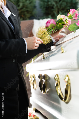 Photo: Mourning People at Funeral with coffin Mourning People at Funeral with coffin