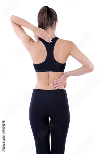 Photo: Back pain in young girls isolated on white Back pain in young girls isolated on white