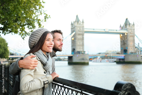 Photo: Happy couple by Tower Bridge, River Thames, London Happy couple by Tower Bridge, River Thames, London