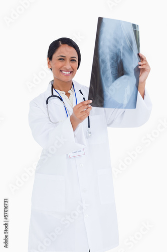 Photo: Smiling female physician with x-ray Smiling female physician with x-ray