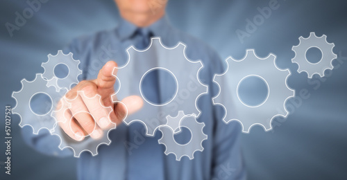 Photo: Businessman touching virtual screen. Businessman touching virtual screen.