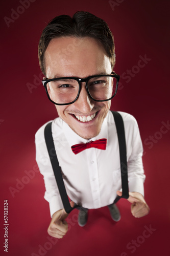 Photo: Portrait of nerdy man wearing red bow tie and suspenders Portrait of nerdy man wearing red bow tie and suspenders