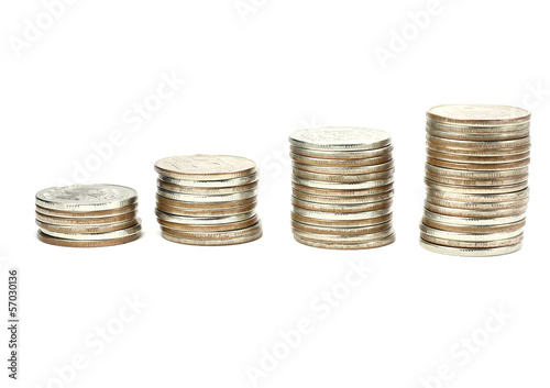 Photo: Stacks of coins on a white background Stacks of coins on a white background
