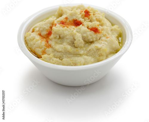 Photo: hummus dip in bowl isolated on white background hummus dip in bowl isolated on white background