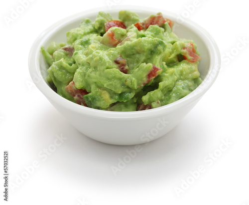 Photo: guacamole dip in bowl isolated on white background guacamole dip in bowl isolated on white background