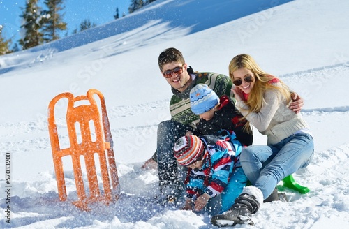 Photo: family having fun on fresh snow at winter family having fun on fresh snow at winter
