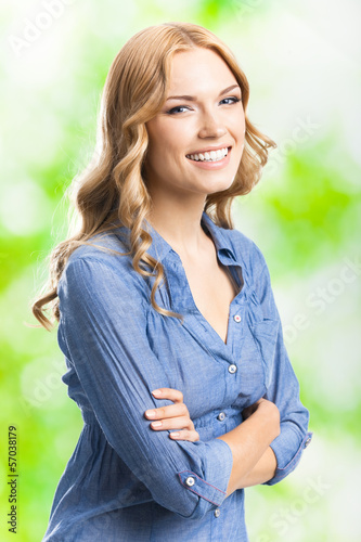 Photo: Happy smiling woman with long hair, outdoor Happy smiling woman with long hair, outdoor