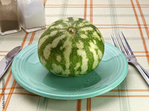 Photo: Watermelon on a blue saucer Watermelon on a blue saucer