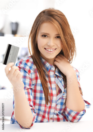 Photo: happy teenage girl with credit card happy teenage girl with credit card