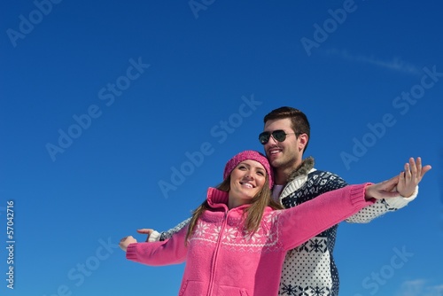 Photo: Young Couple In Winter Snow Scene Young Couple In Winter Snow Scene