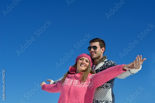 Photo: Young Couple In Winter Snow Scene Young Couple In Winter Snow Scene