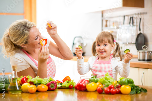 Photo: mom and kid preparing healthy food mom and kid preparing healthy food