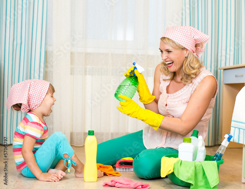 Photo: mother with kid cleaning room and having fun mother with kid cleaning room and having fun