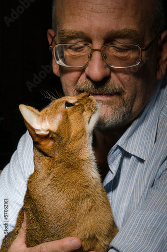 Photo: Mature man with his cat Mature man with his cat