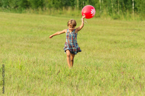 Photo: The girl with ball in hands The girl with ball in hands