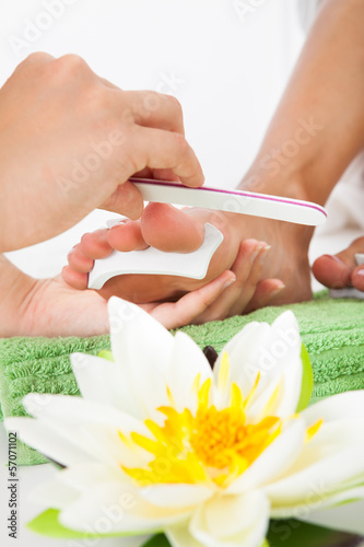 Photo: Manicurist Filing A Female Nails Manicurist Filing A Female Nails