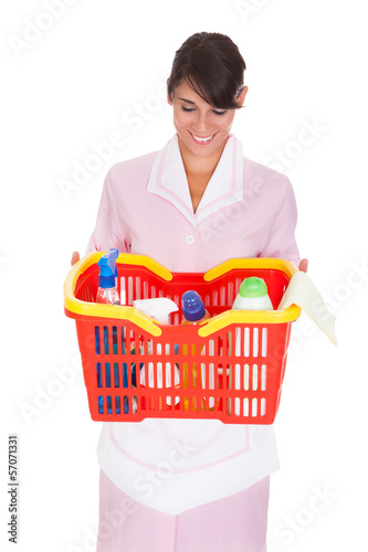 Photo: Female Cleaner With Cleaning Supplies Female Cleaner With Cleaning Supplies