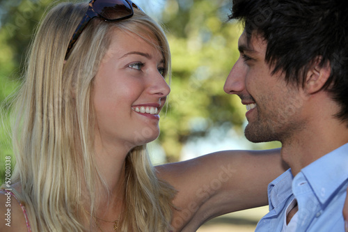 Photo: Young couple in love embracing in the sunshine Young couple in love embracing in the sunshine
