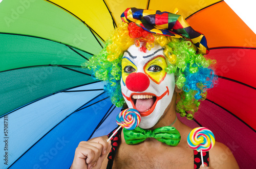 Photo: Clown with umbrella and lollypop Clown with umbrella and lollypop
