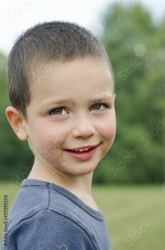 Photo: Smiling child portrait outdoors Smiling child portrait outdoors