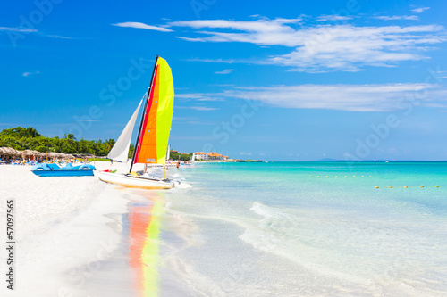 Photo: Scene with sailing boat at Varadero beach in Cuba Scene with sailing boat at Varadero beach in Cuba
