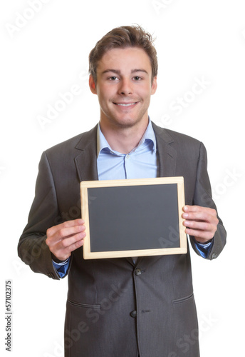 Photo: Smart businessman with chalkboard Smart businessman with chalkboard