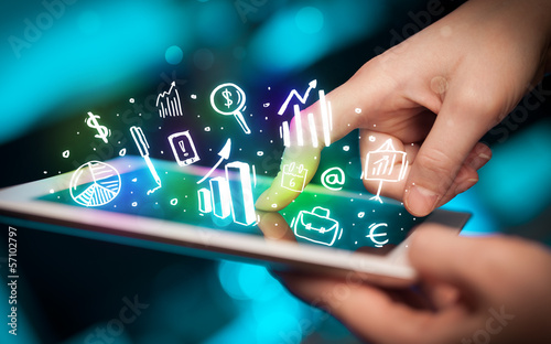 Photo: Hand touching tablet pc, charts concept Hand touching tablet pc, charts concept