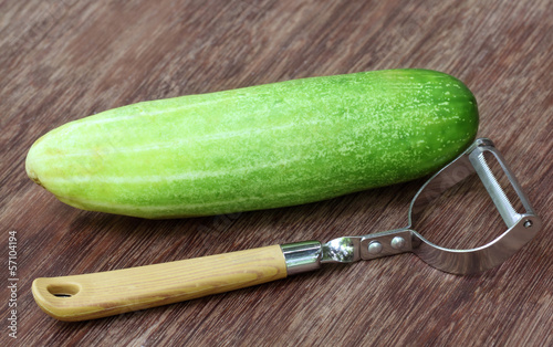 Photo: Fresh cucumber with peeler Fresh cucumber with peeler