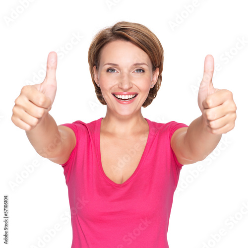 Photo: Portrait of a beautiful adult happy woman with thumbs up sign Portrait of a beautiful adult happy woman with thumbs up sign