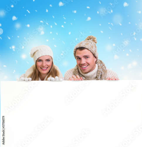 Photo: winter couple holding copy space winter couple holding copy space