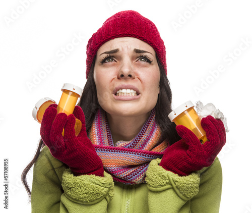 Photo: Sick Mixed Race Woman with Empty Medicine Bottles Blowing Nose . Sick Mixed Race Woman with Empty Medicine Bottles Blowing Nose .