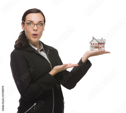 Photo: Mixed Race Businesswoman Holding Small House to the Side. Mixed Race Businesswoman Holding Small House to the Side.