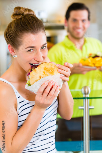 Photo: Kebab - customer and hot Doner with fresh ingredients Kebab - customer and hot Doner with fresh ingredients