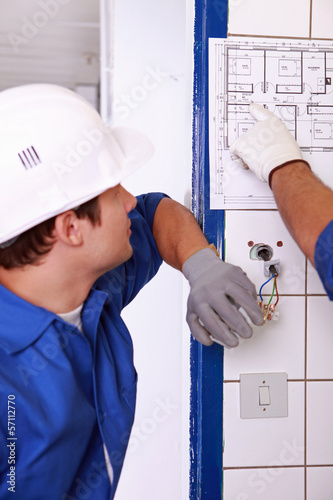Photo: electrician watching plan electrician watching plan