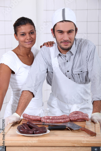 Photo: Couple working in a butchers Couple working in a butchers
